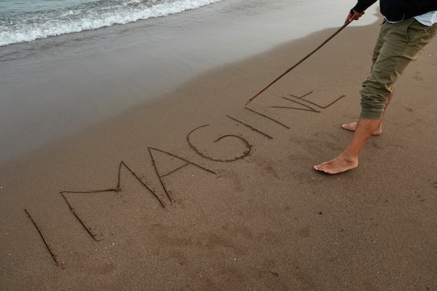 View of beach sand in summertime with message written in it