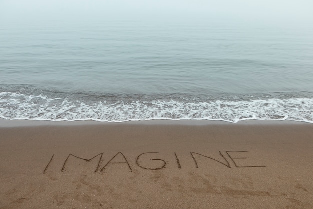 View of beach sand in summertime with message written in it