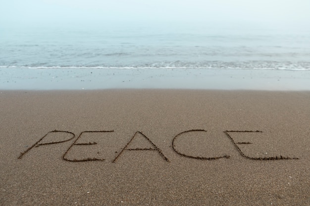 View of beach sand in summertime with message written in it