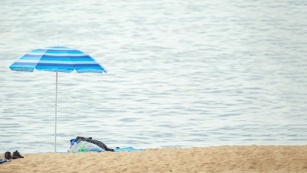 View at beach umbrella on the shoreline by the water