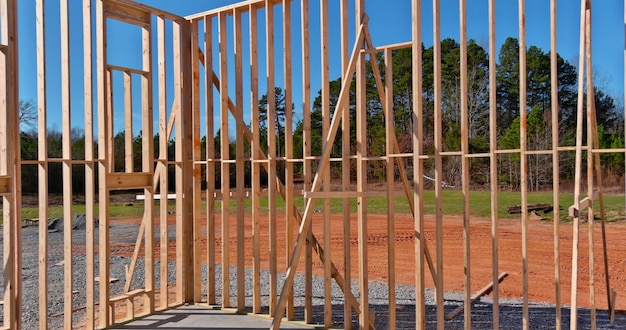 View of beams stick built new home under construction framing building