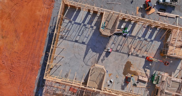 View of beams stick built new home under construction framing building