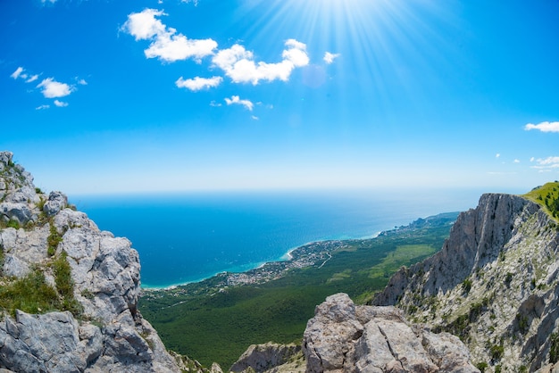 View of the Black Sea from Mount Ai-Petri. Below the village of Alupka Big Yalta. Cloudy sunny weather.