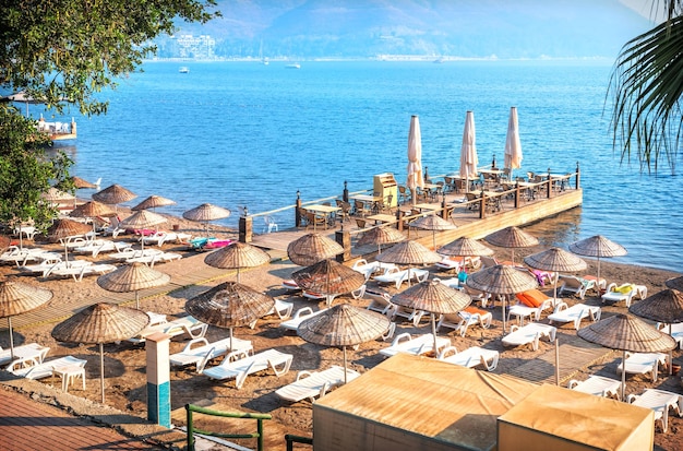 View of the blue sea pier and greenery of the hotel Marmaris Turkey