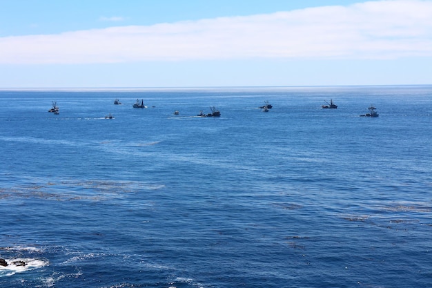 View of boats in calm blue sea