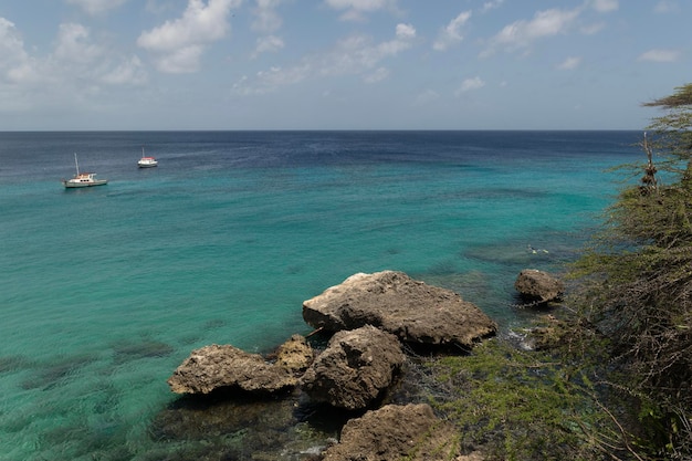 View of boats saliling in the caribbean sea seen from cas abao beach curacao