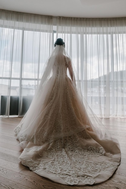 View of bride from the back romantic atmosphere of the bride's morning Elegant wedding dress