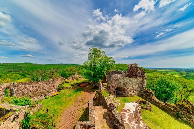 A view of the castle ruins in Hohnstein in the Harz near Nordhausen in Germany. Beautiful castle ruins in summer weather.