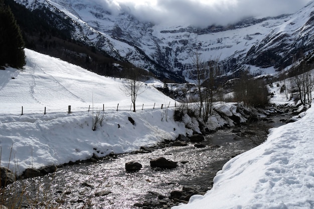 View of the Cirque de Gavarnie under cloudy sky