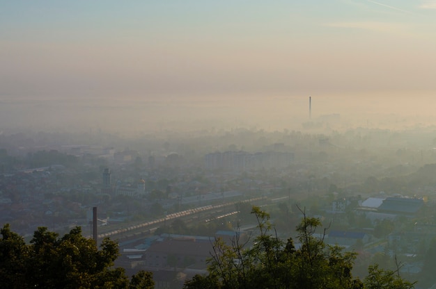 View of the city from high in the morning in the fog