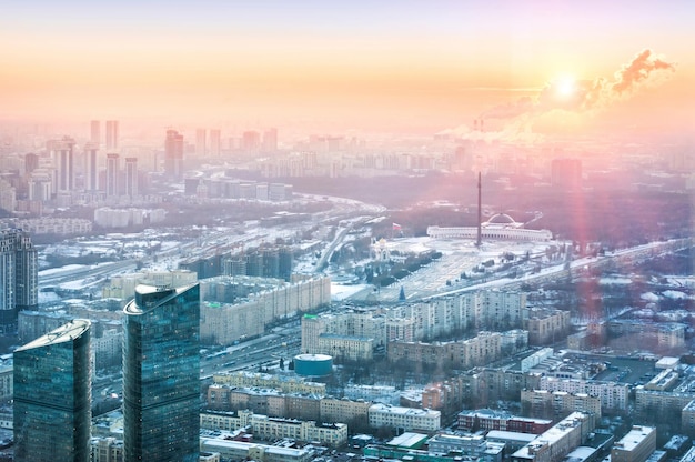 View of the city from the observation deck on skyscrapers in the setting sun Poklonnaya Gora and Victory Park Moscow City