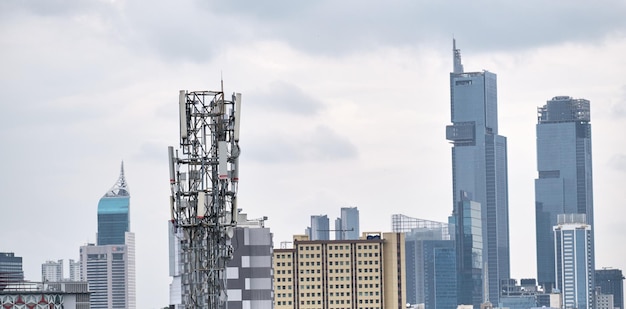 A view of a city with a tower that says huawei on it.