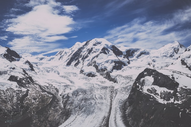 View closeup mountains scene in national park Zermatt, Switzerland, Europe. Summer landscape, sunshine weather, dramatic blue sky and sunny day