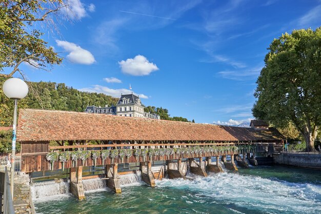 View of the covered wooden bridge in the city of Thun Switzerland