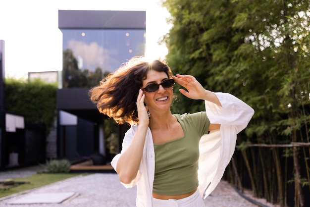 View of cute woman smiling in sunglasses