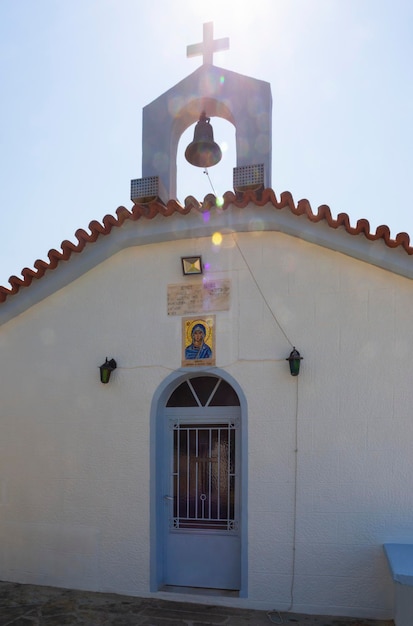 View of the Cycladic style Greek Church on the beach on the Greek island of Evia in Greece