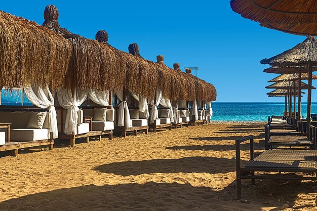 View of deck chairs and umbrellas on the sandy beach of Kemer Turkey