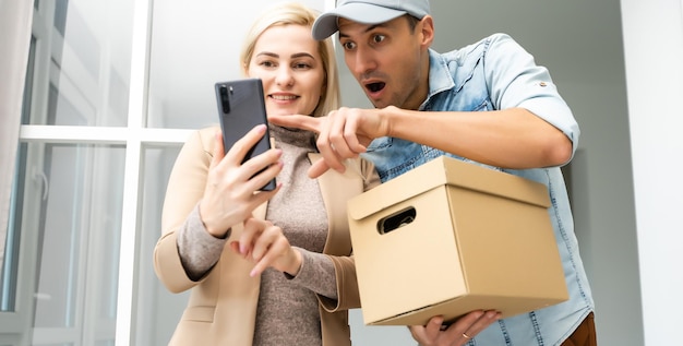 View of a Delivery man handing over a parcel to customer