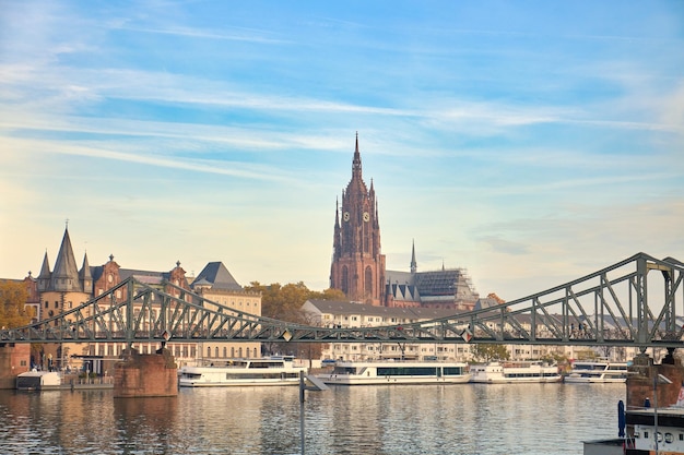 View of the dome of a cathedral over the iron bridge on the river Main Frankfurt Germany