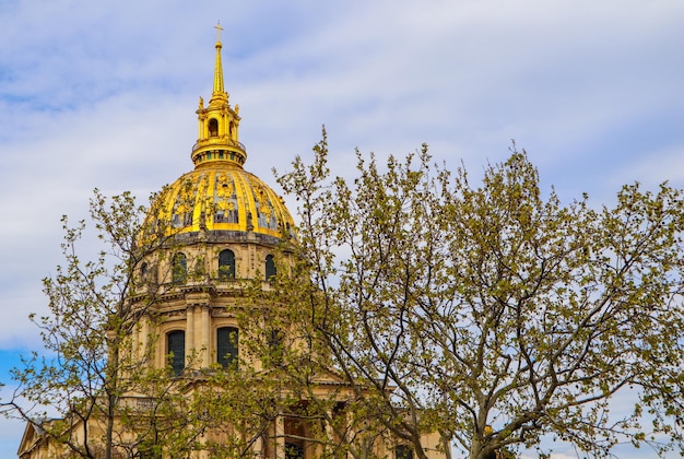 View on the Dome church of Les Invalides through trees in spring in Paris France. April 2019