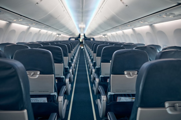 View of economy seats inside the coach cabin of airplane