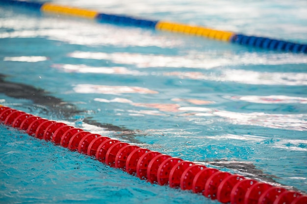 The view of an empty public swimming pool indoors Lanes of a competition swimming pool Sport concept