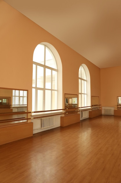 View of empty studio with mirrors and ballet barres