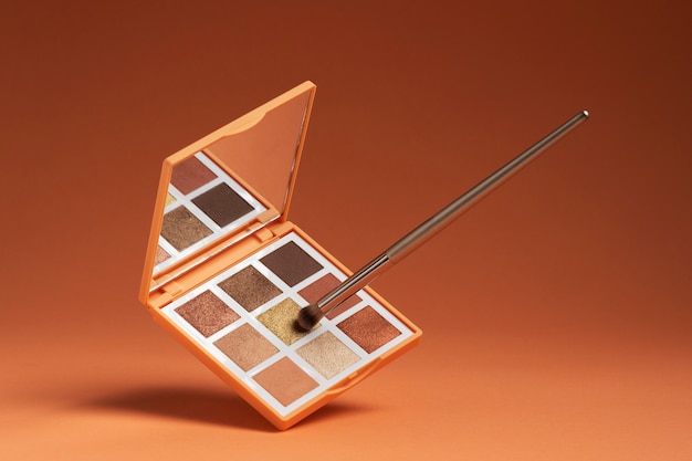 View of eyeshadow palette with brush applicator