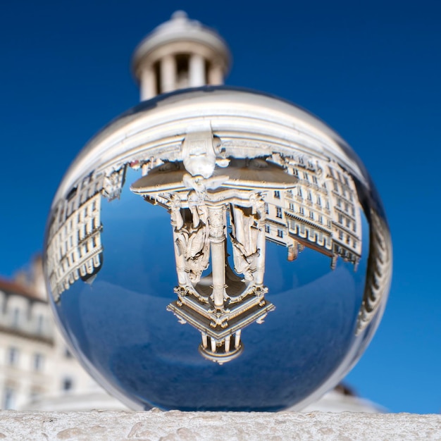 View of famous Jacobins Fountain through crystal ball