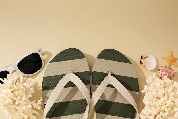 View of flip flops with summer essentials and sunglasses