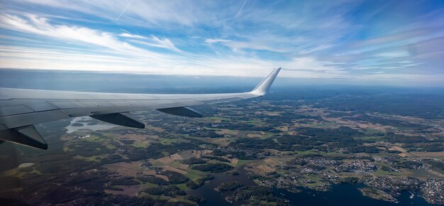 View from airplane window Flying plane above the city