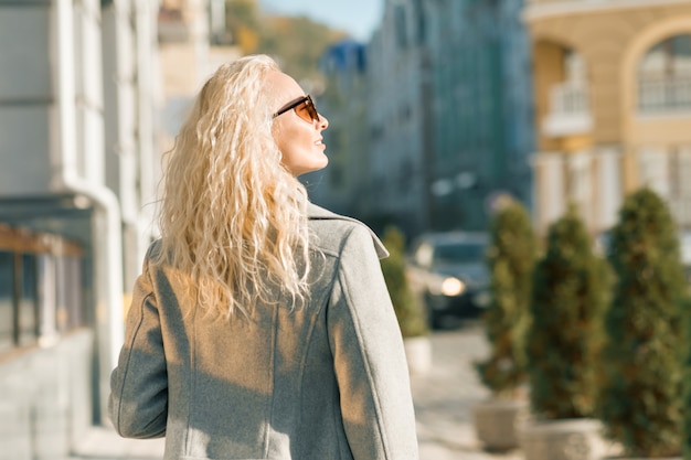 View from the back of young blonde woman