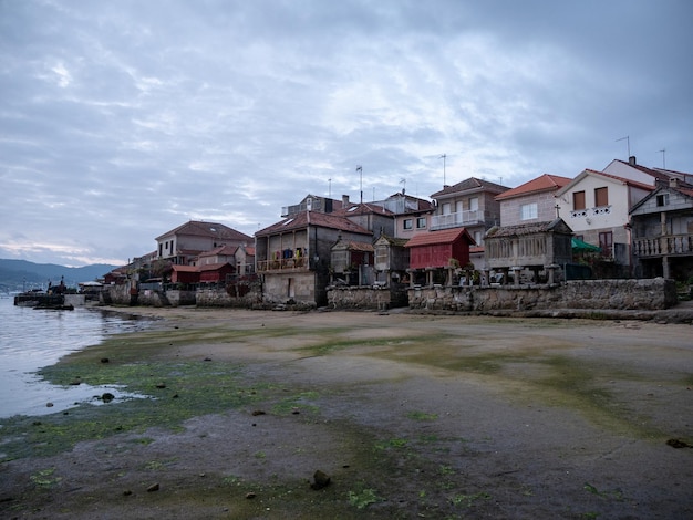 View from the beach of the traditional granaries in the village of Combarro