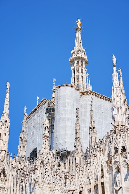 View from the bottom of duomo cathedral building during reconstruction process building facade