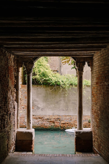 View from the building on to a small narrow canal between houses in venice italy a view from a