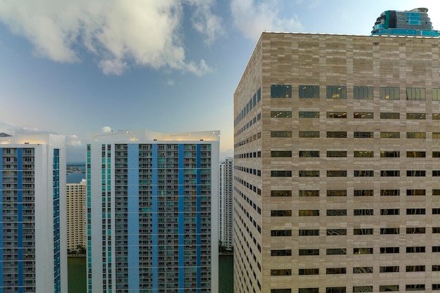 View from above of concrete and glass skyscraper buildings in downtown district of Miami Brickell in Florida USA at sunset American megapolis with business financial district at nightfall