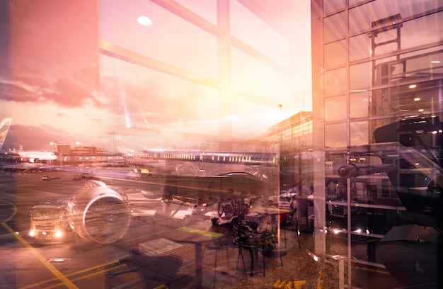 View from glass window of the airport building to outside Passenger plane docking at the airport