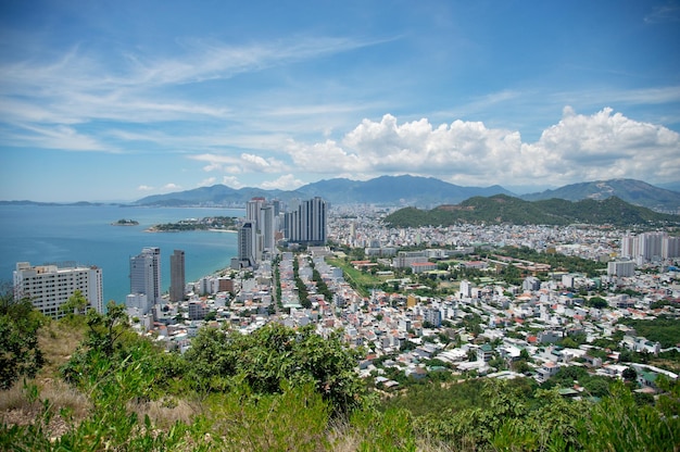 view from the mountain to the resort town with the ocean and mountains