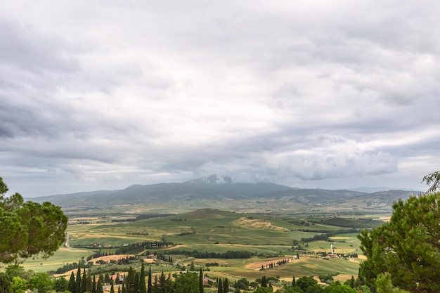 View from Pienza historic center to the green valley down Val d'Orcia Tuscany Italy