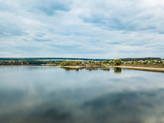 View from above on a river and a bridge with a blue sky