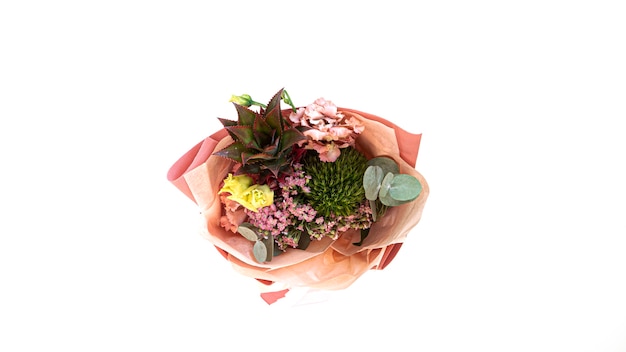 View from the top of wrapped exotic bouquet of decorative pineapple, green hydrangea and eucalyptus.