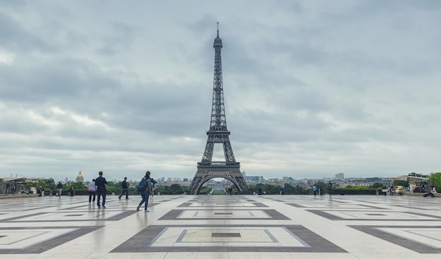 View from the Trocadero square (Place du Trocadero) to the eiffel tower at a cloudy day in paris. ideal for websites and magazines layouts