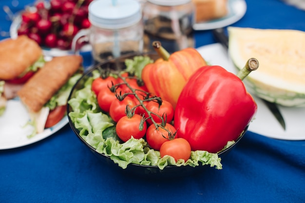 View from above of vegetables, fruits and sandwiches