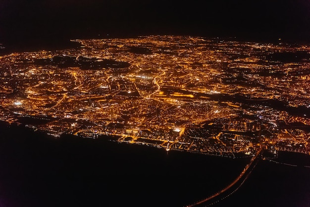 View from the window of an airplane during a flight landing in Lisbon