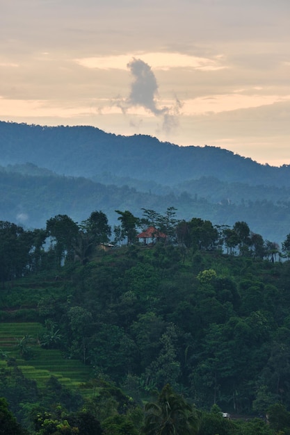 View of the hills in the afternoon after the rain is filled with mist