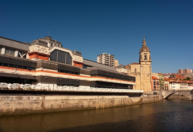 View of the historic La Ribera Market in the Nervion river Bilbao