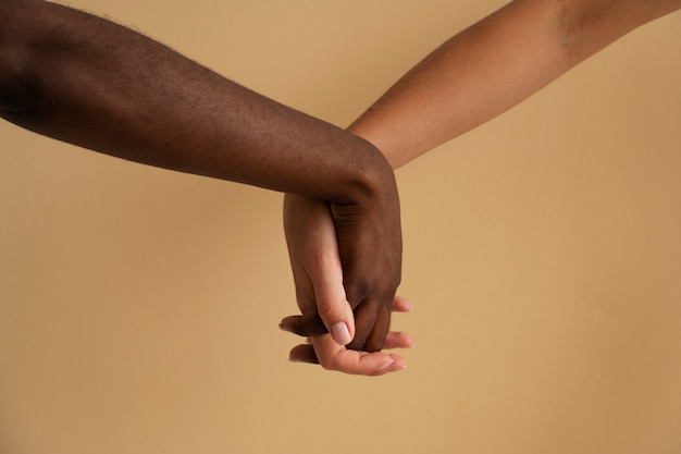 View of human hands against colored background