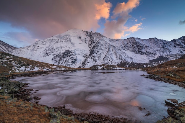 View of the icy lake and the high snowy mountains