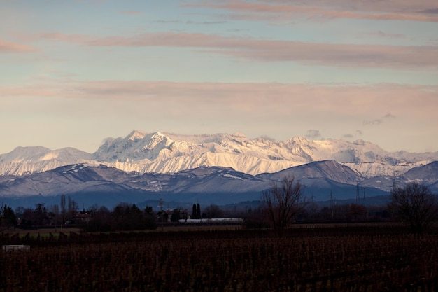 View of the Italian countryside with alp mountains on the background