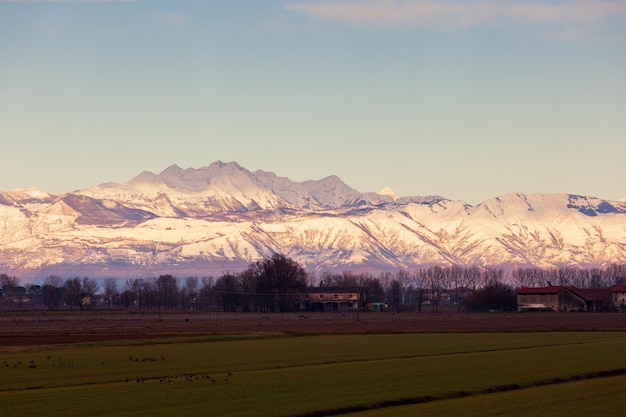 View of the Italian countryside with alp mountains on the background